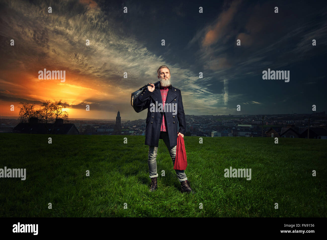 Hipster man holding travel bag Stock Photo