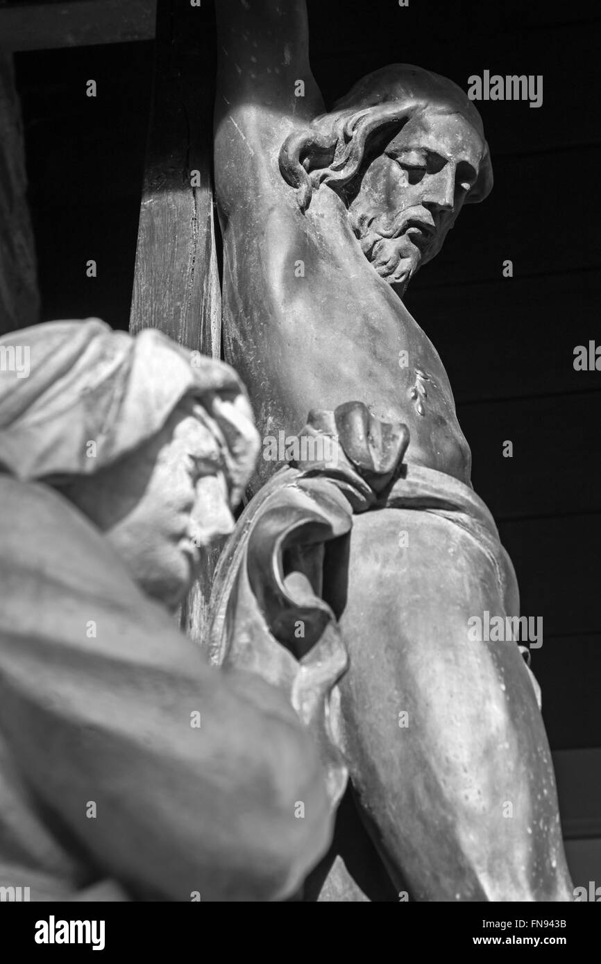 Bruges - The statue of holy Mary under Christ on the cross from little park near of Sint Janshospital Stock Photo