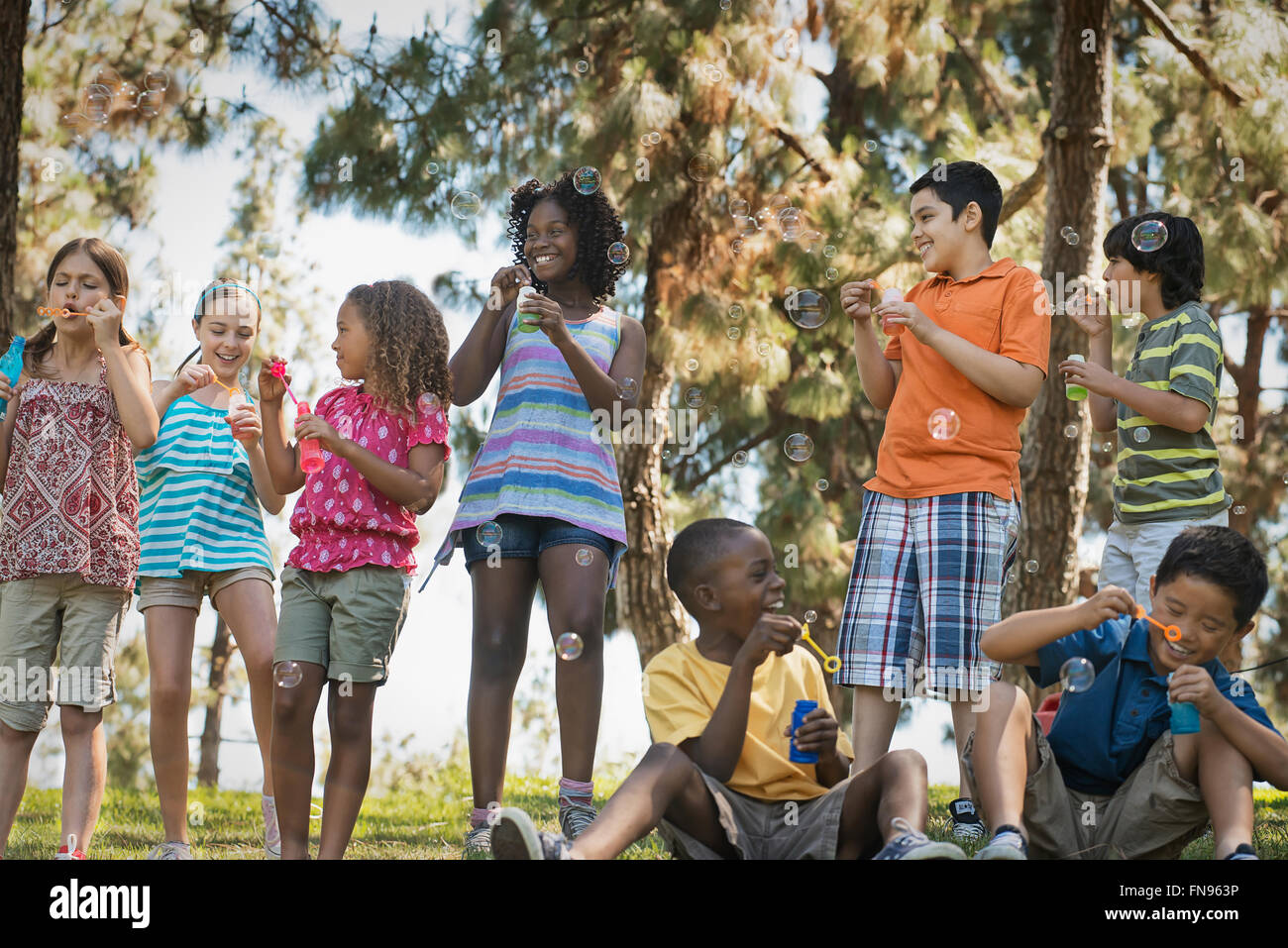 Children playing outdoors in summer Stock Photo