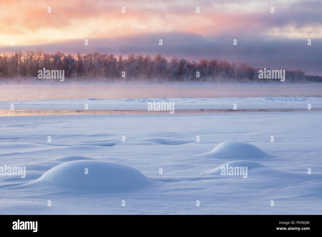 Frozen river at sunrise, Sodankyla, Lapland, Finland Stock Photo