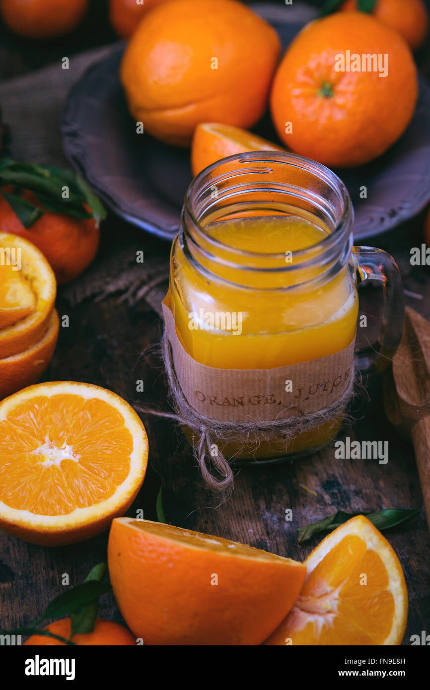 Freshly squeezed orange juice and oranges Stock Photo Alamy