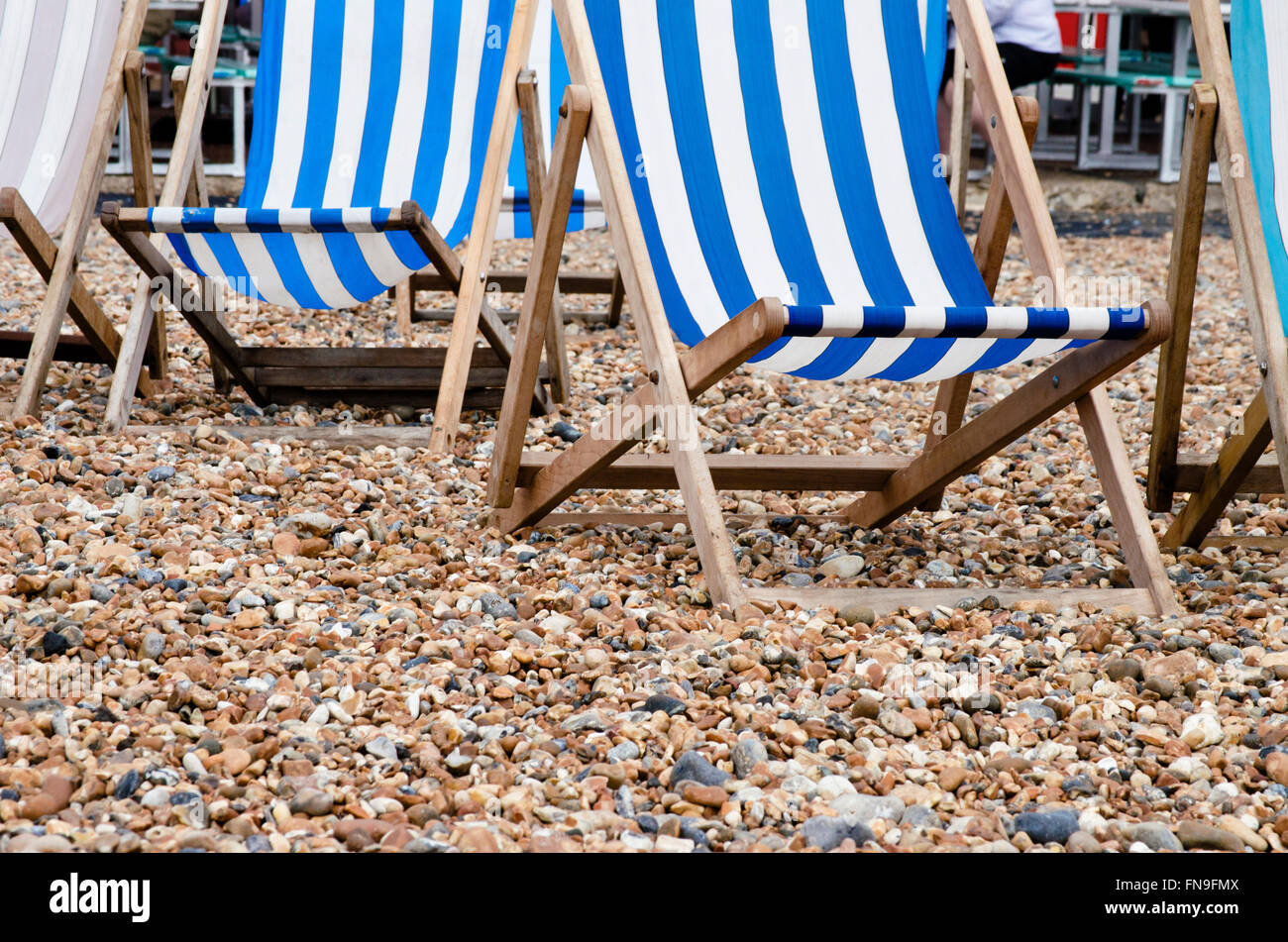 Deckchairs on the beach, Brighton, East Sussex, England, United Kingdom Stock Photo
