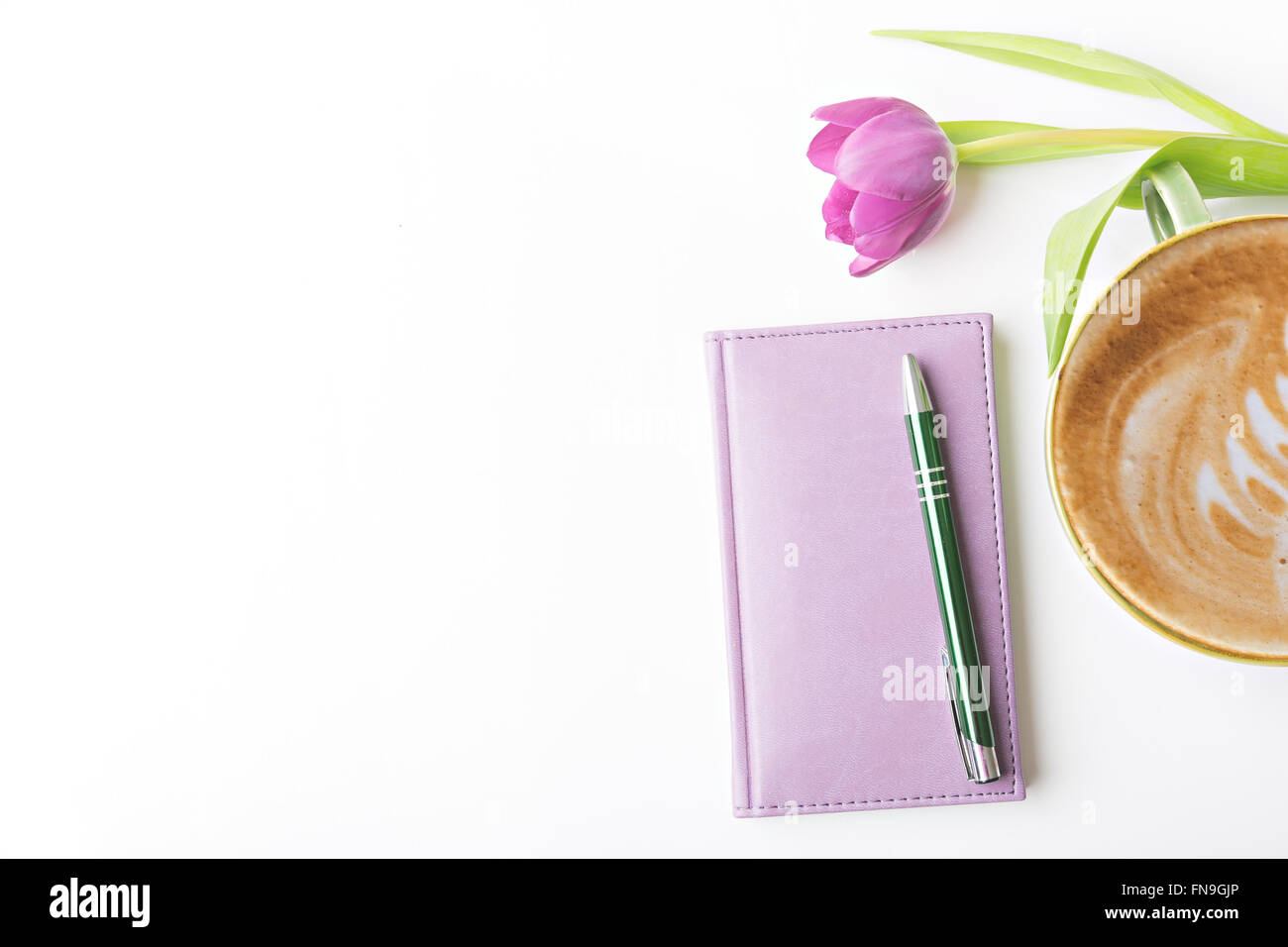 closed notebook with pen and coffee, flat lay Stock Photo
