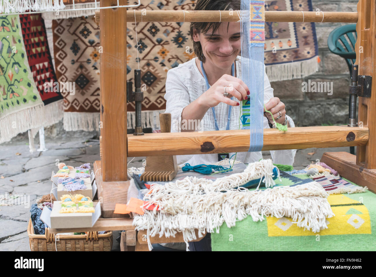 Woman weaving loom Stock Photo