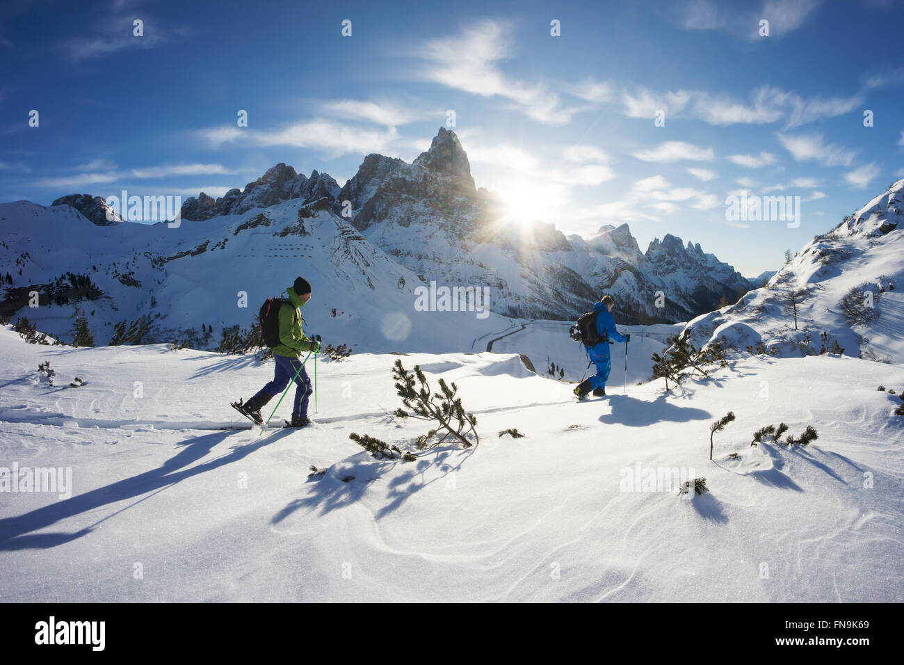 Two skiers, Dolomites, Italy Stock Photo