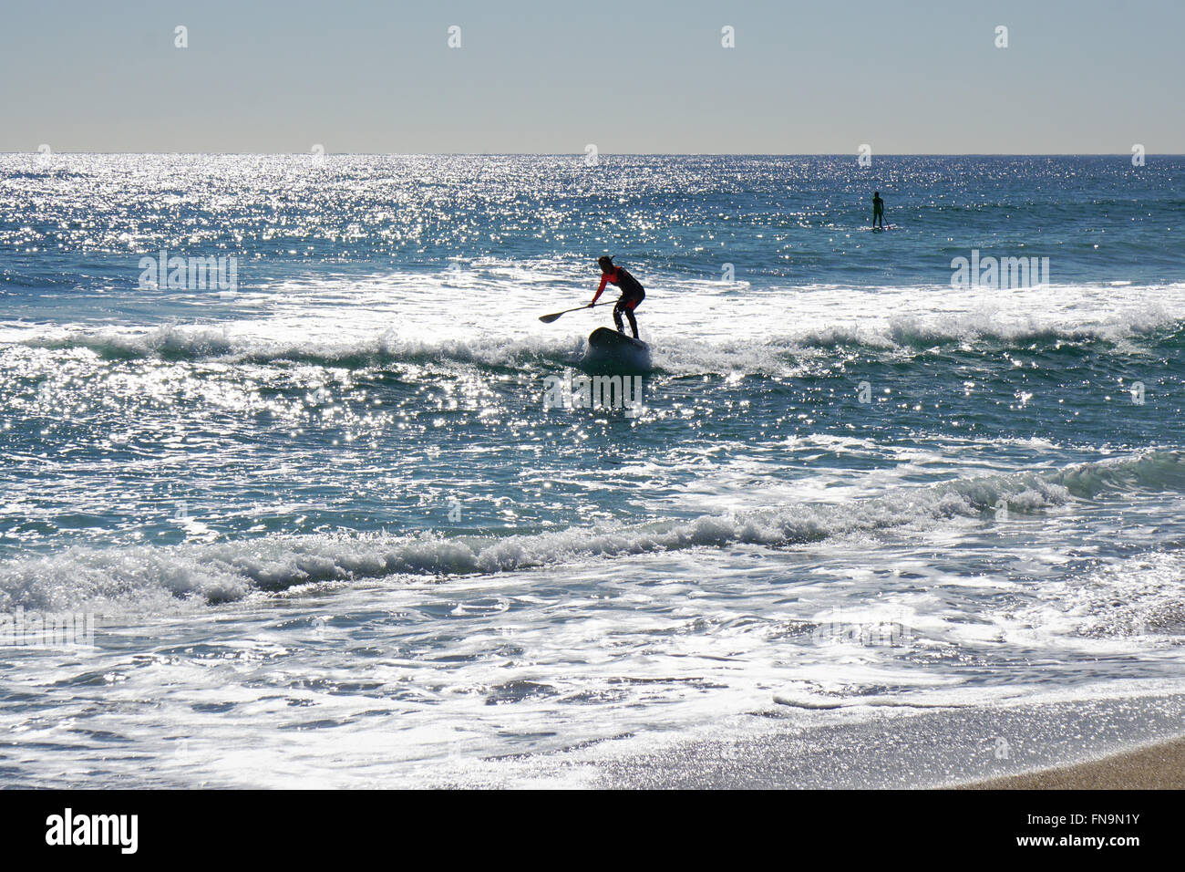 Stand up paddle surfing or standup paddleboarding Stock Photo