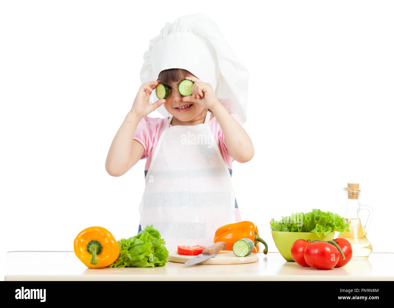 Funny chef girl cooking at kitchen Stock Photo