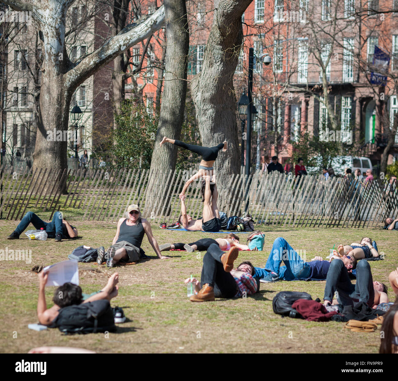 Visitors to Washington Square Park in New York enjoy the unseasonably warm weather on Wednesday, March 9, 2016.  Temperatures in the city broke a 16 year record climbing to a high of 77 degrees.  (© Richard B. Levine) Stock Photo