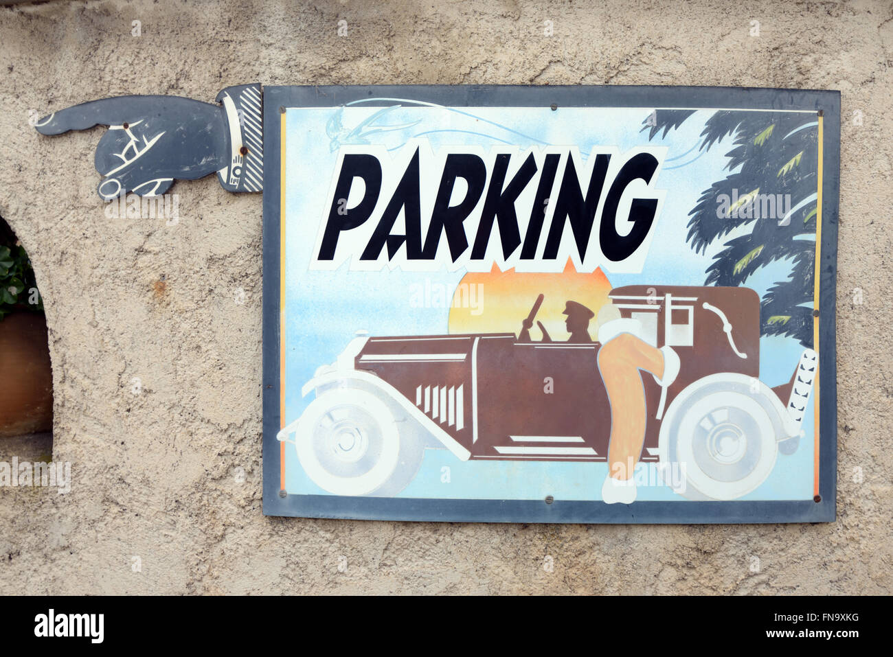 Vintage or Old Parking Sign with Vintage or Veteran Car or Automobile Stock Photo