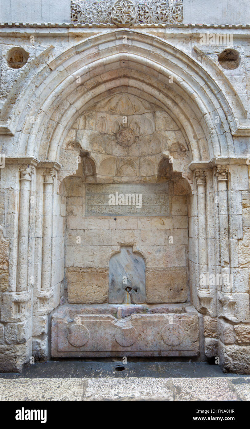Jerusalem - Fountain with Arabic inscription on Hagai (El Wad) street in the Muslim quarter. Stock Photo