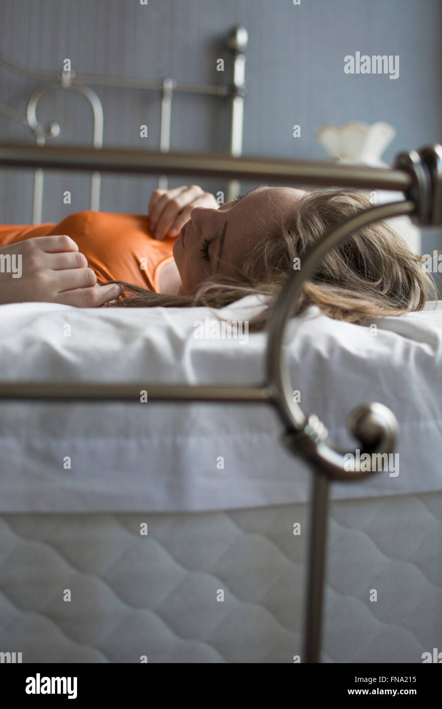 One Woman Alone Bed Sad Lonely Stock Photos & One Woman Alone Bed Sad
