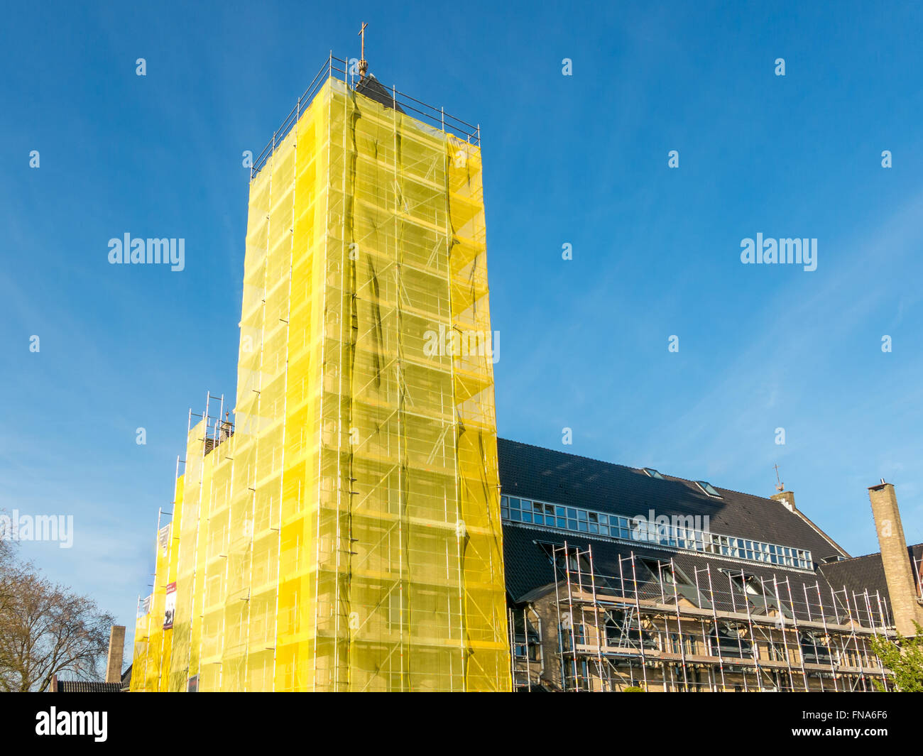 Scaffold construction to renovate church tower building in Hilversum in the Netherlands Stock Photo