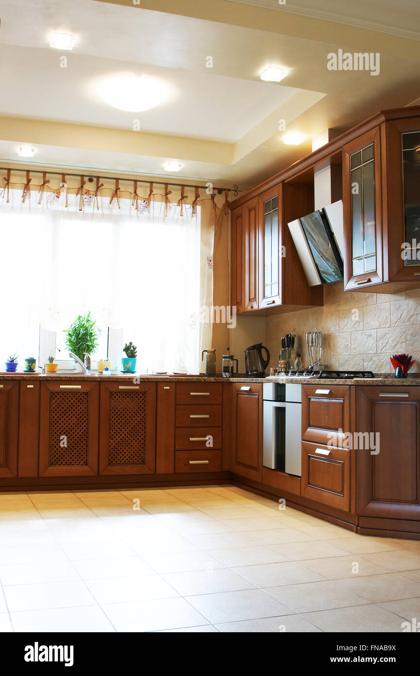 Wooden kitchen furniture in the modern house Stock Photo Alamy