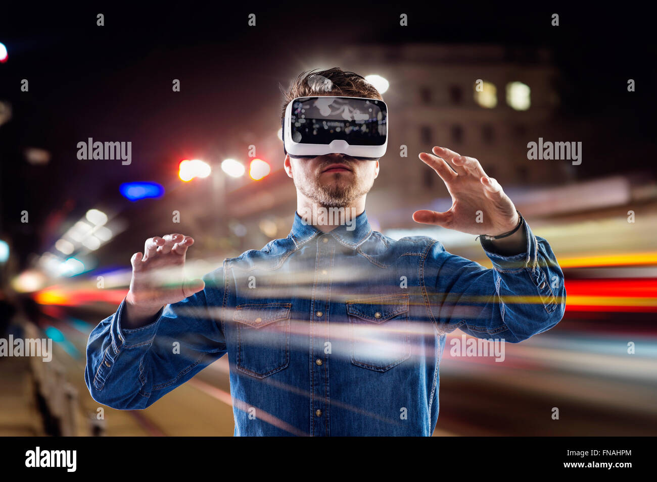 Double exposure, man wearing virtual reality goggles, night city Stock ...