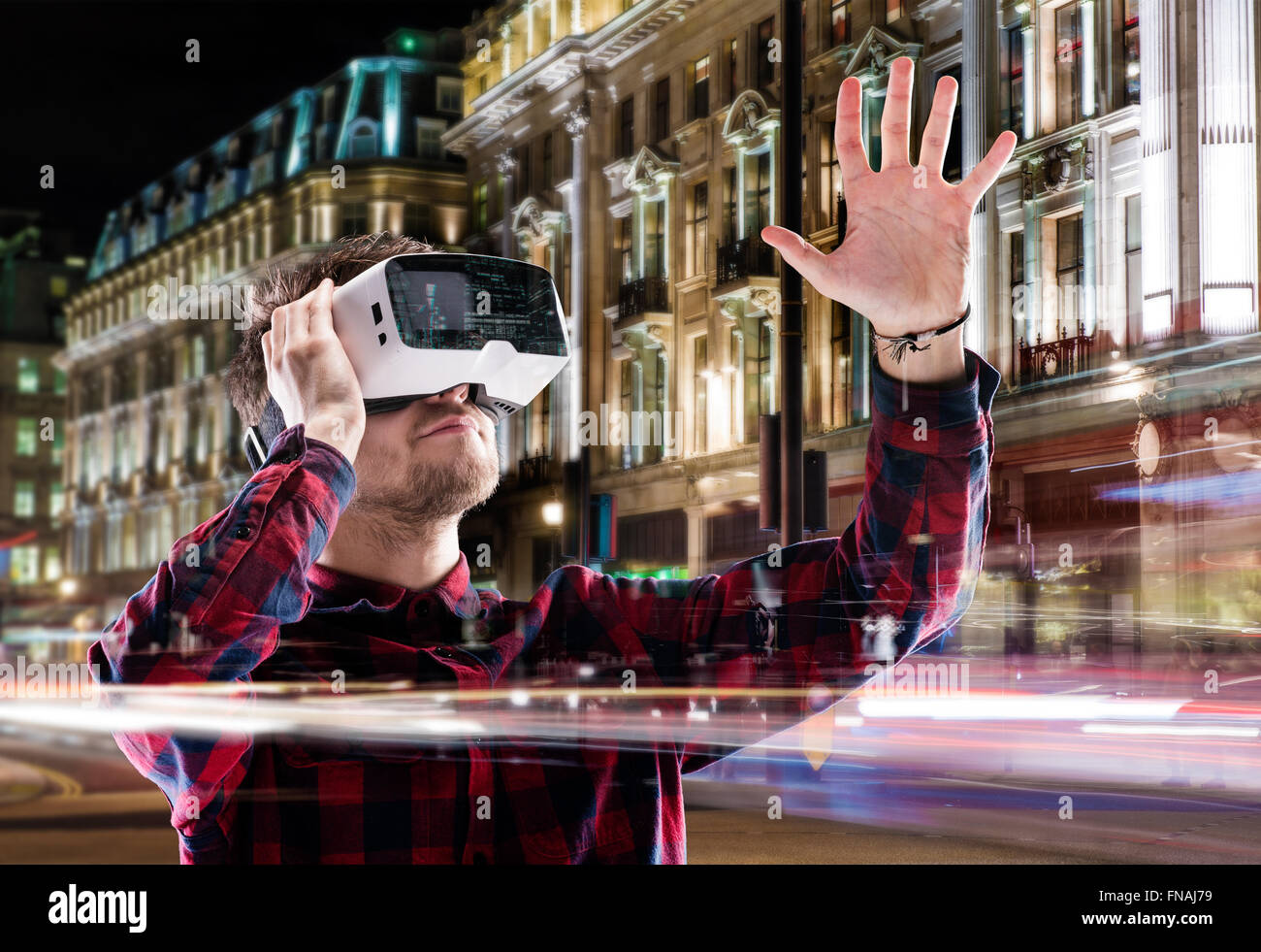 Double exposure, man wearing virtual reality goggles, night city Stock ...
