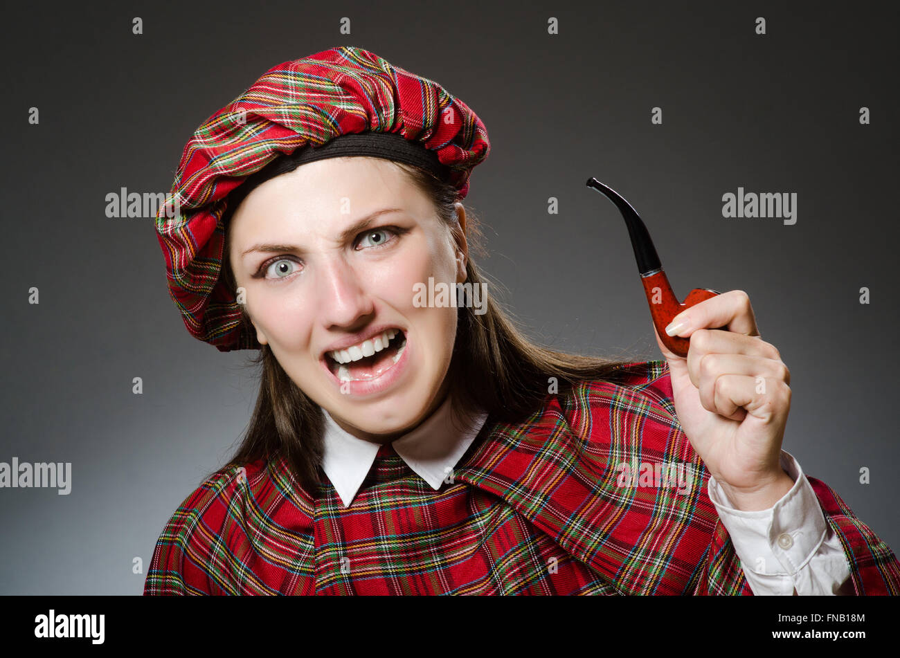 Woman wearing traditional scottish clothing Stock Photo