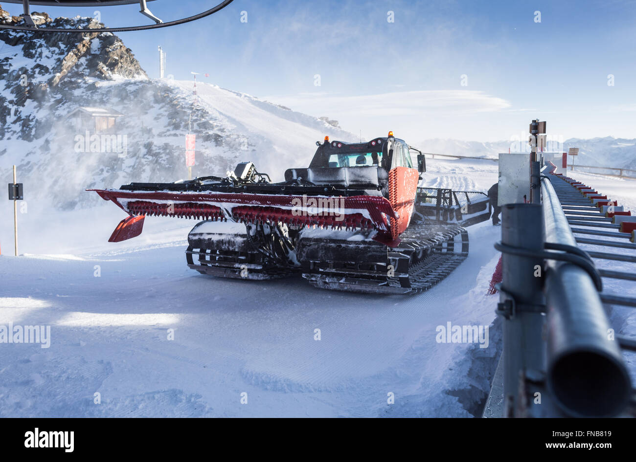 Snow Groomer in windy conditions Stock Photo