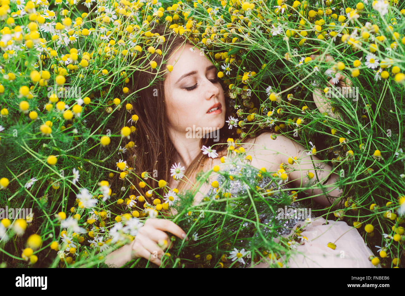 Portrait of young girl with closed eyes in chamomile field Stock Photo ...