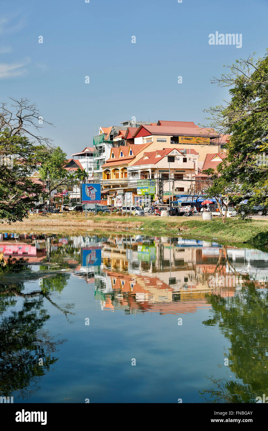 Colorful buildings reflected on Siem Reap River, Siem Reap, Cambodia Stock Photo