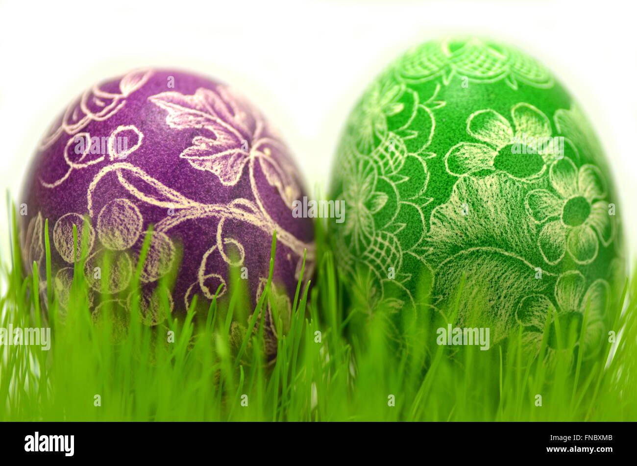 traditional scratched handmade Easter eggs in the grass Stock