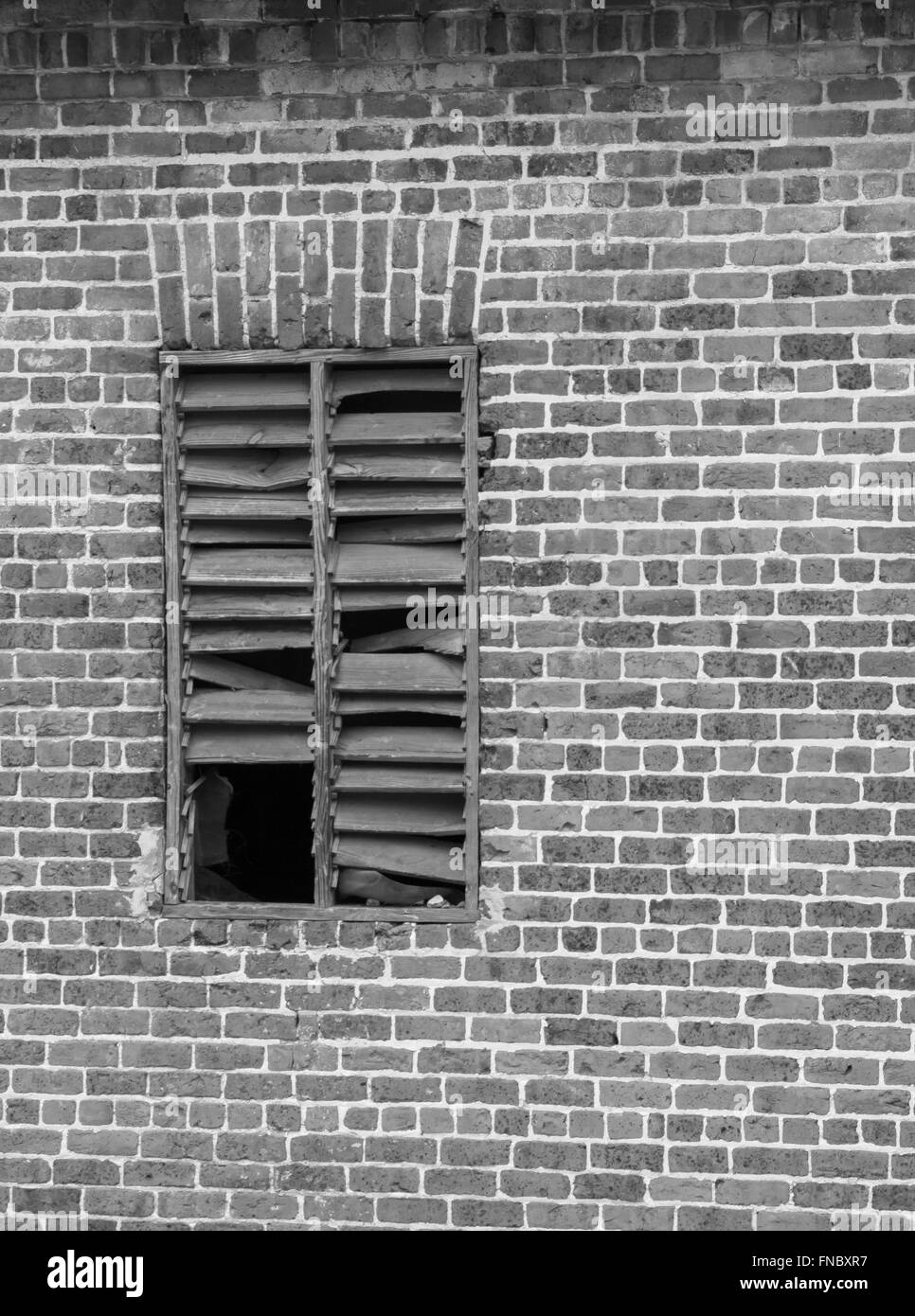 Brick wall window opening in a very old building. Stock Photo