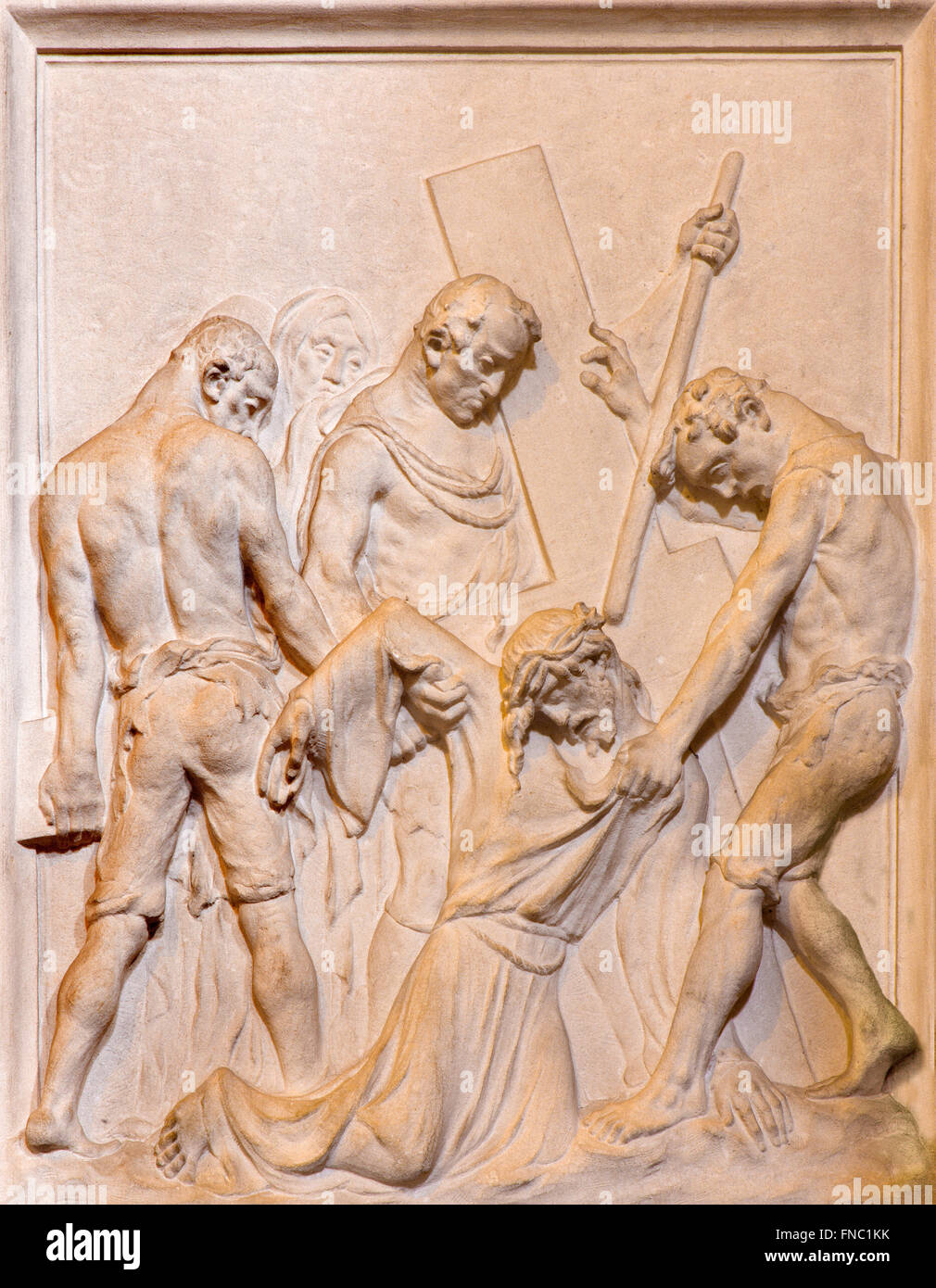 BRUSSELS, BELGIUM - JUNE 15, 2014: Stone relief of Jesus fall under the cross in church Notre Dame du Bon Secource. Stock Photo