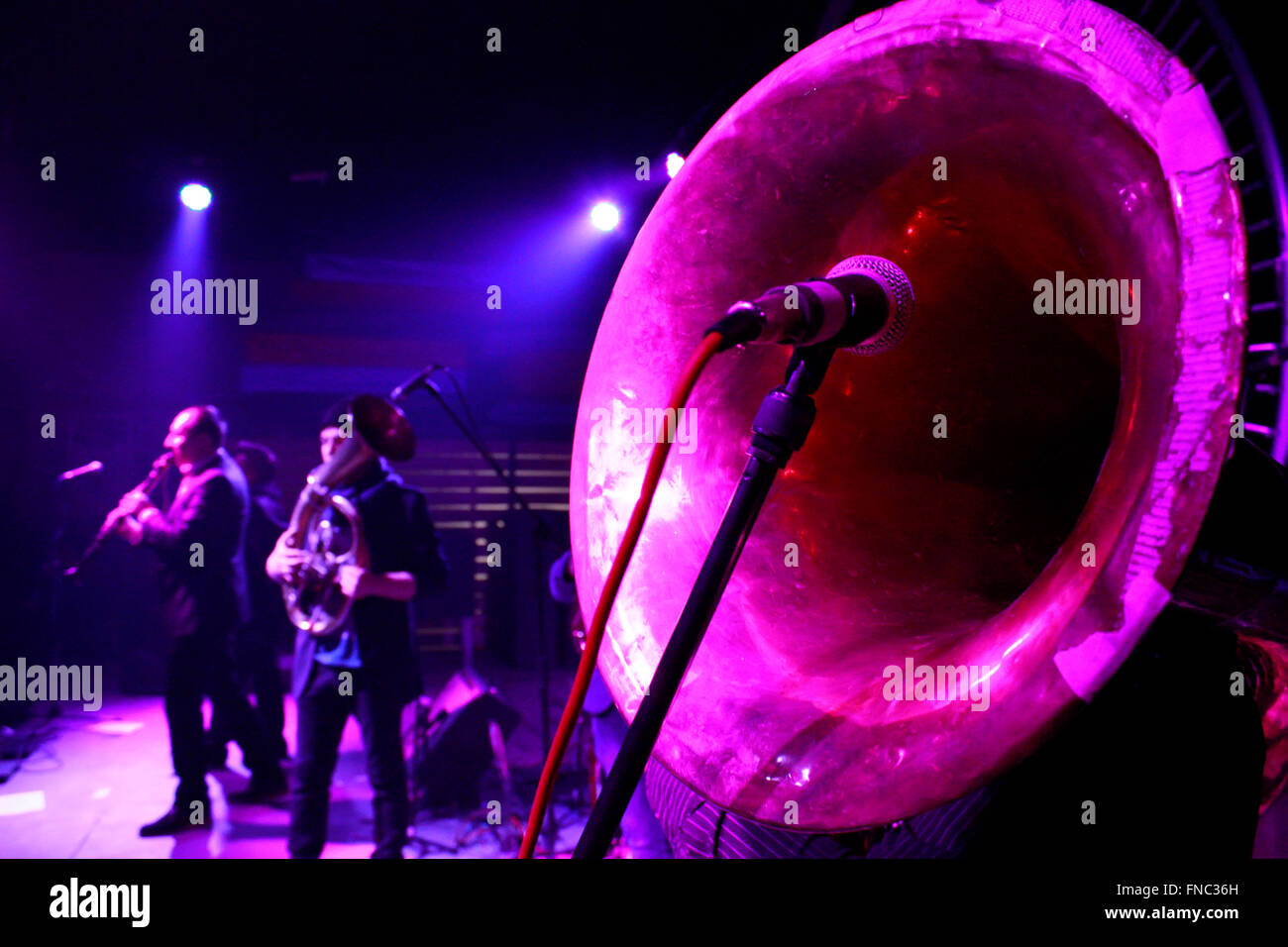 Front side Sousaphone brass instrument closeup and artists on stage. Luboyna band during BalkanFest festival, Thessaloniki, GR Stock Photo