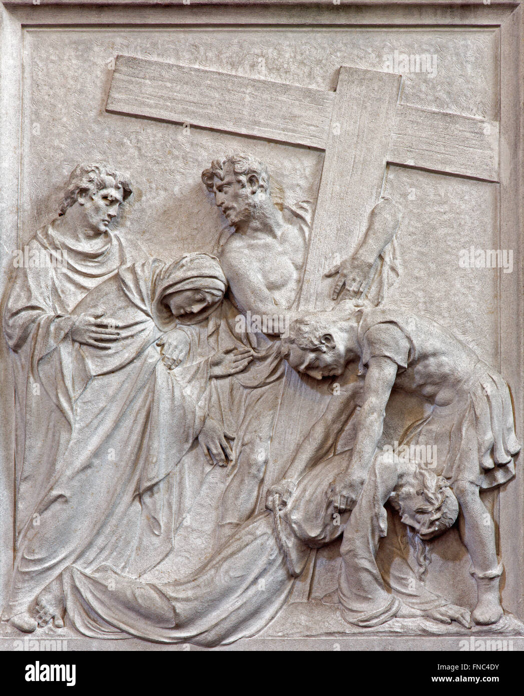 BRUSSELS, BELGIUM - JUNE 15, 2014: Stone relief Jesus fall under cross in church Notre Dame du Bon Secource. Stock Photo