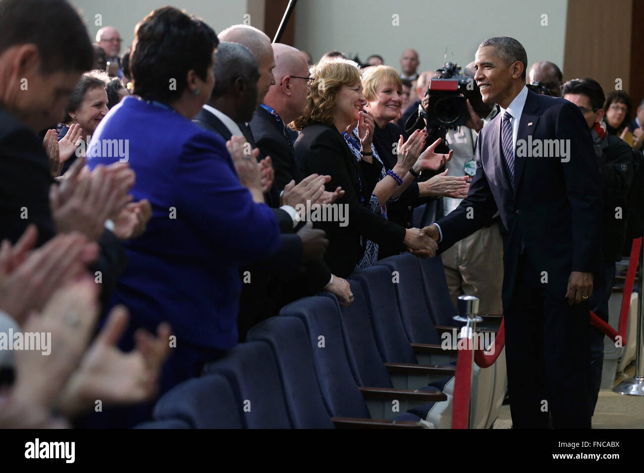 Washington, District of Columbia, USA. 14th Mar, 2016. United States President Barack Obama (R) greets State Department staff after addressing the Chief of Missions Conference in the Dean Acheson Auditorium at the Harry S Truman building March 14, 2016 in Washington, DC. Obama highlighted the work and sacrifice done by the United States' diplomatic corps and talked about his administration's accomplishments. Credit: Chip Somodevilla/Pool via CNP Credit:  Chip Somodevilla/CNP/ZUMA Wire/Alamy Live News Stock Photo