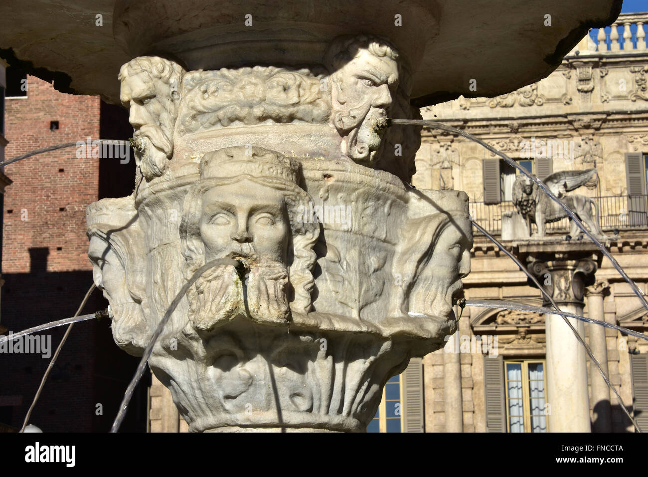 Detail from the ancient Fountain of Madonna Verona, in the center of Piazza delle Erbe square, with Venice Lion in the backgroun Stock Photo