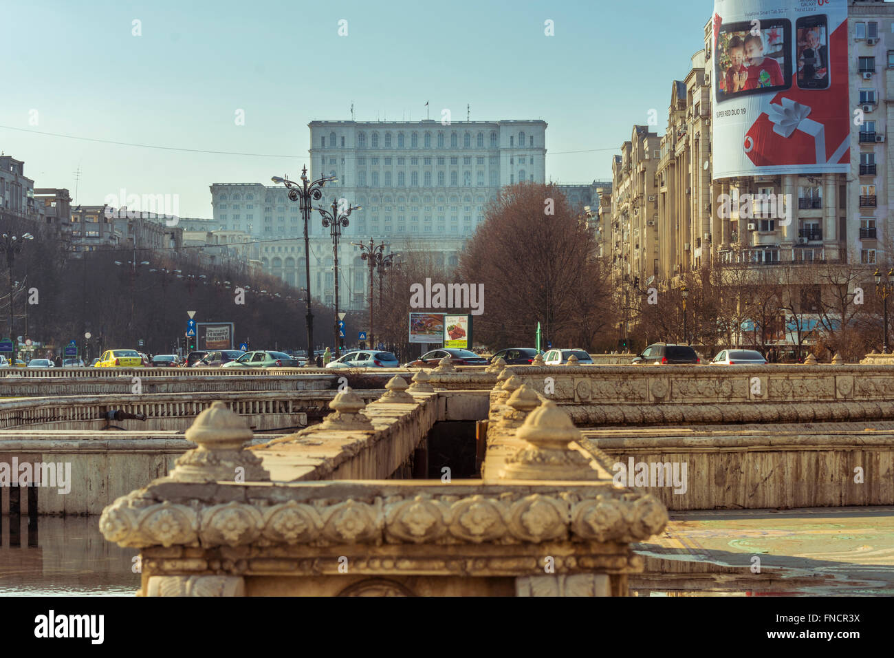 BUCHAREST, ROMANIA - FEBRUARY 06, 2016: Downtown Bucharest Unirii Square with Palace of the Parliament in background. Palace of  Stock Photo