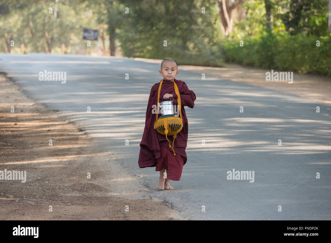 A young monk on his morning alms round, Bagan, Myanmar Stock Photo - Alamy