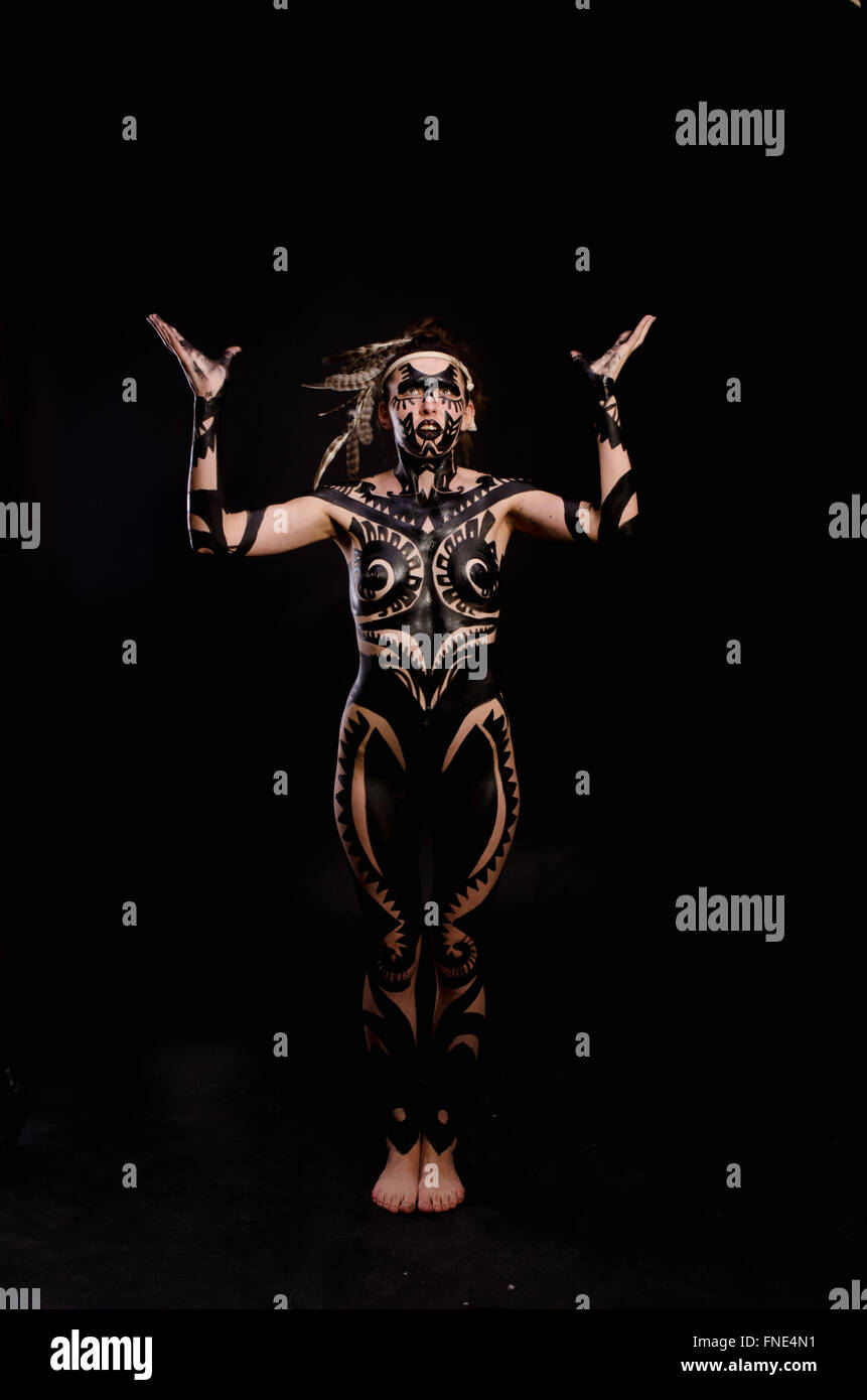 Woman body painted in black hi-res stock photography and images