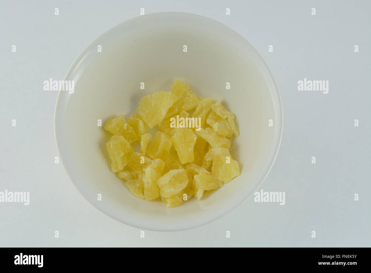 Dried pineapple chunks in bowl Stock Photo Alamy