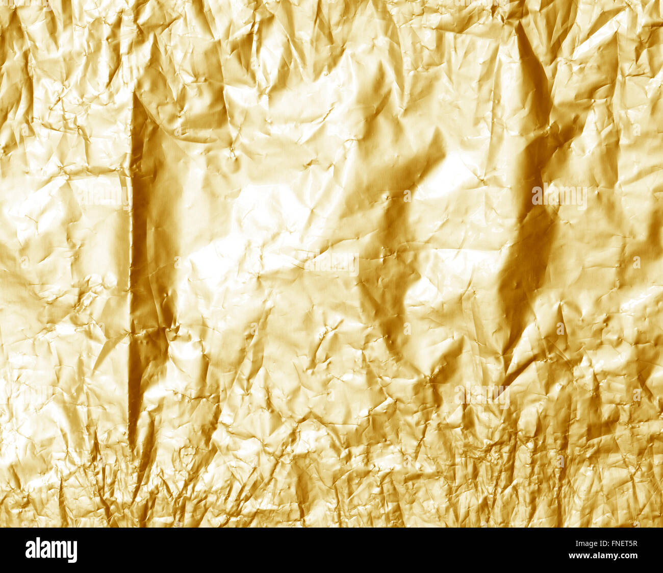 Shiny yellow leaf gold foil texture background Stock Photo