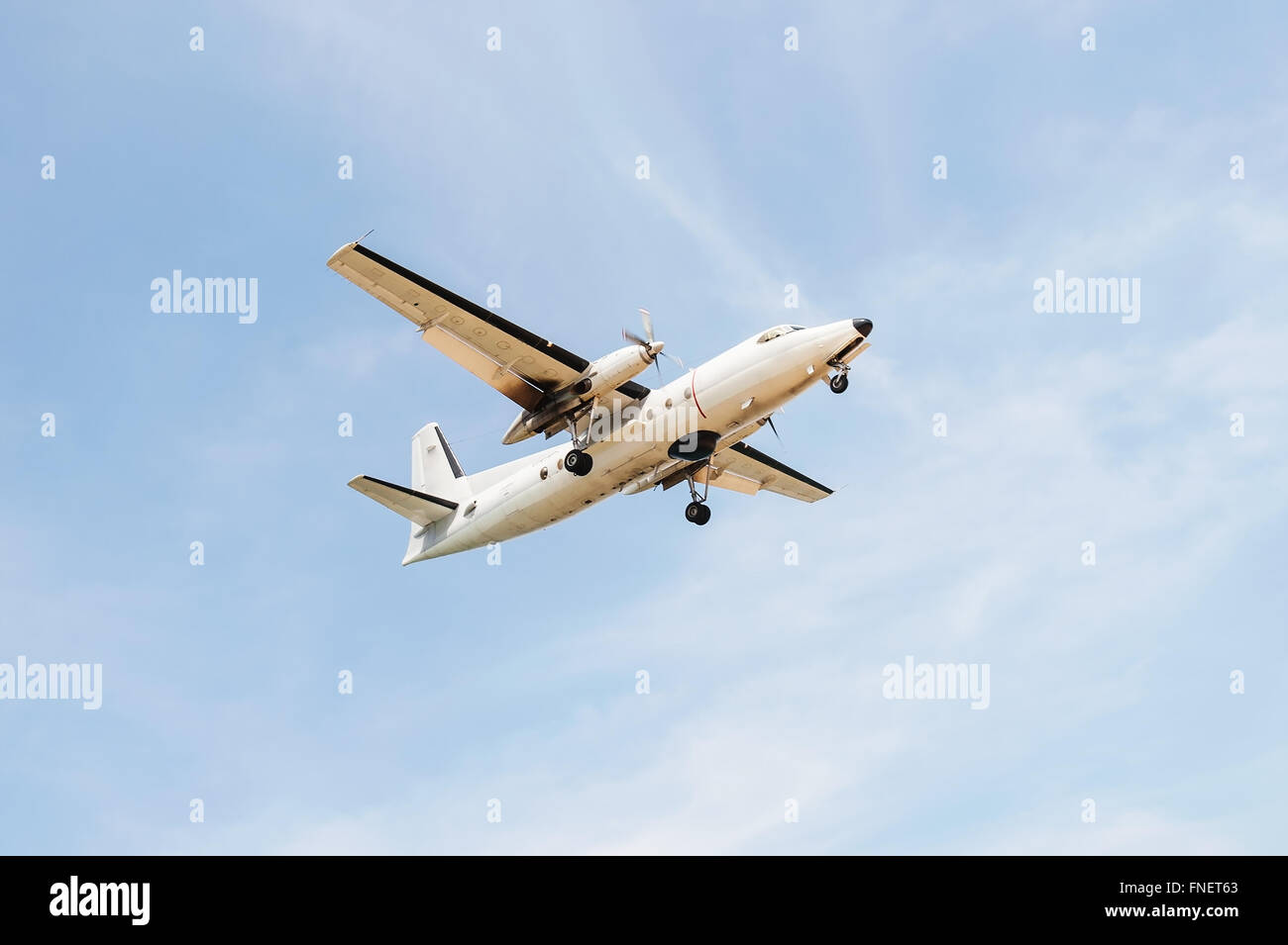 Old plane with blue sky and white cloud background Stock Photo