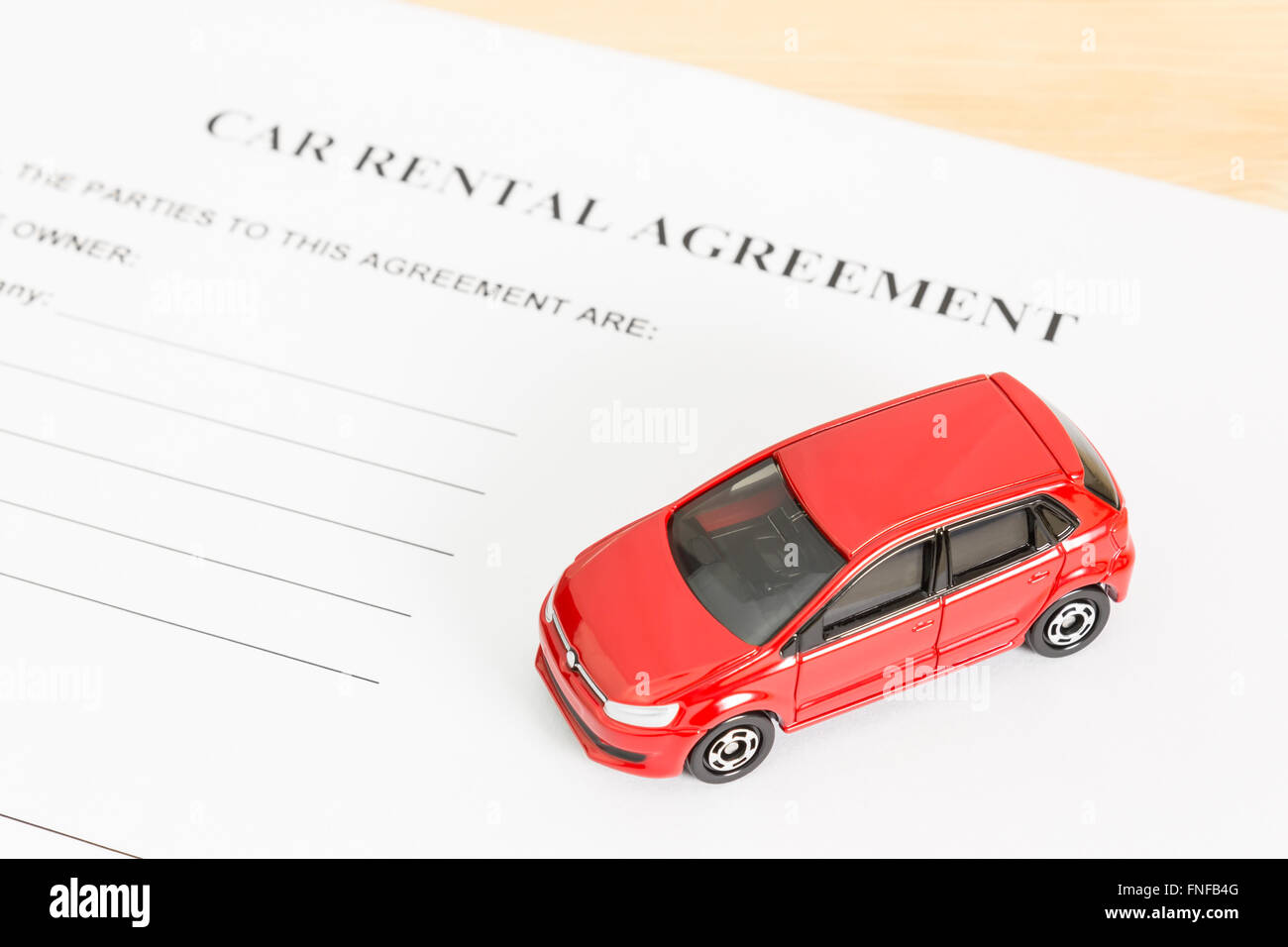 Car rental agreement with red car at bottom right corner. Auto rental agreement or legal