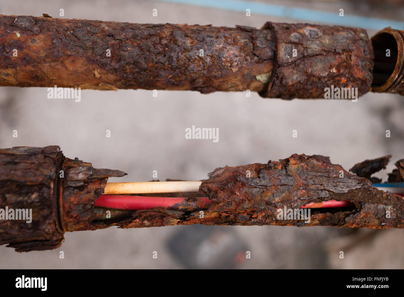 Fragments of old pipes ,metal pipe destroyed. Rusty steel tube with