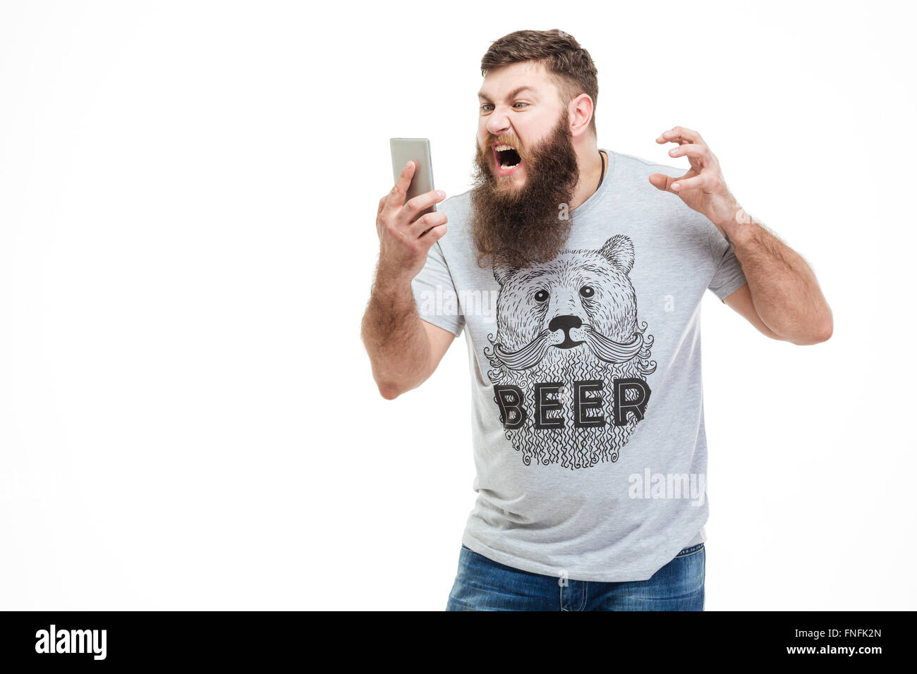 Premium Photo  Handsome bearded guy holds smartphone and plays online games  joyful man wearing a black stylish hat and a blue shirt crazy emotions