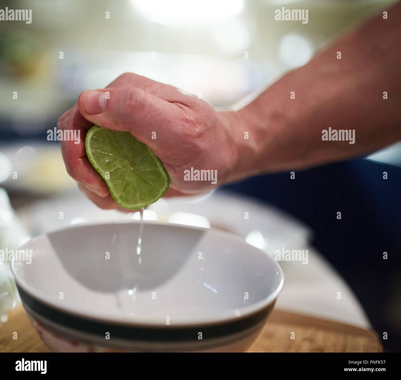 Squeezing lemon in cooking hi-res stock photography and images - Alamy