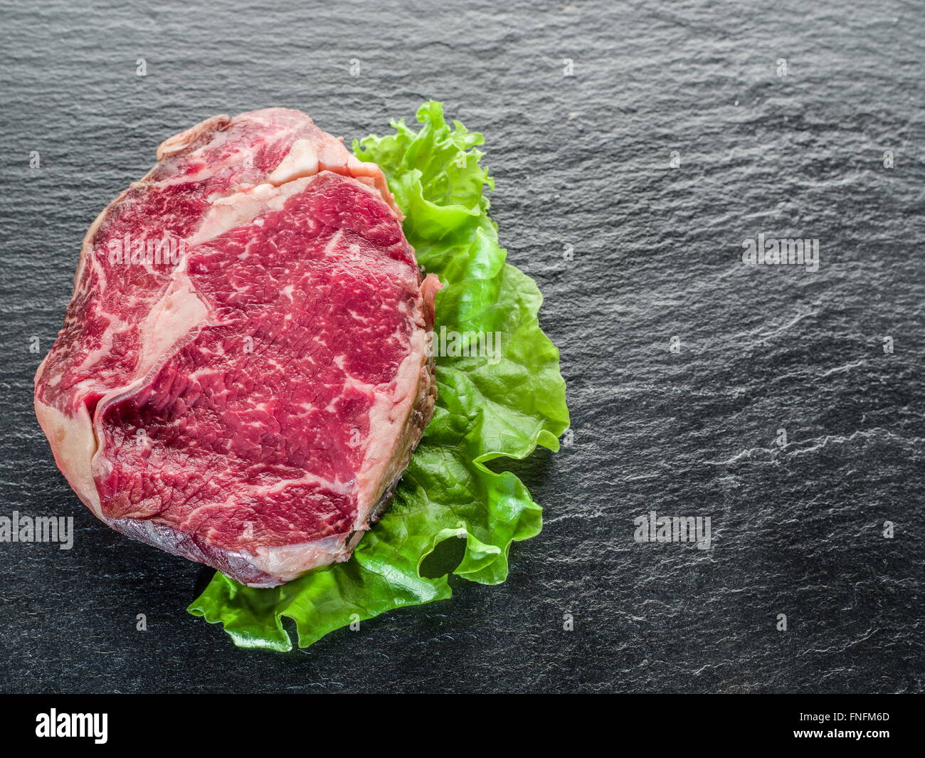 Steak Ribeye on the black graphite background Stock Photo Alamy
