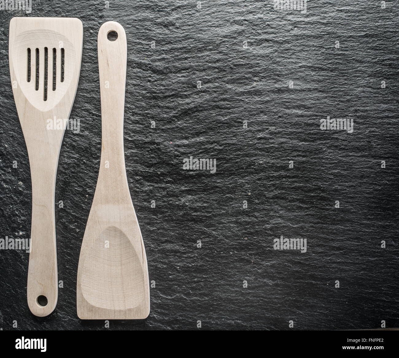 Kitchen utensils on the graphite background. Stock Photo