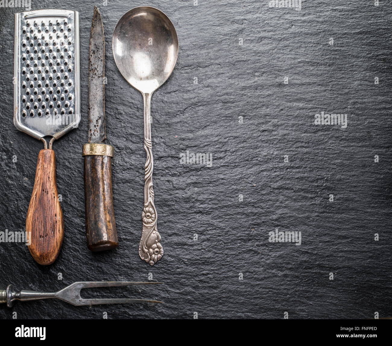Kitchen utensils on the graphite background Stock Photo Alamy