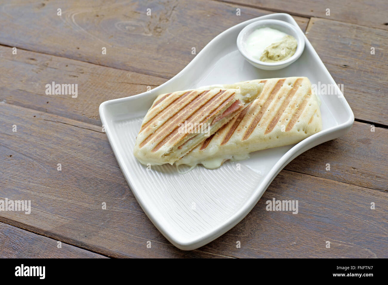 delicious ham cheese sandwich on white plate Stock Photo