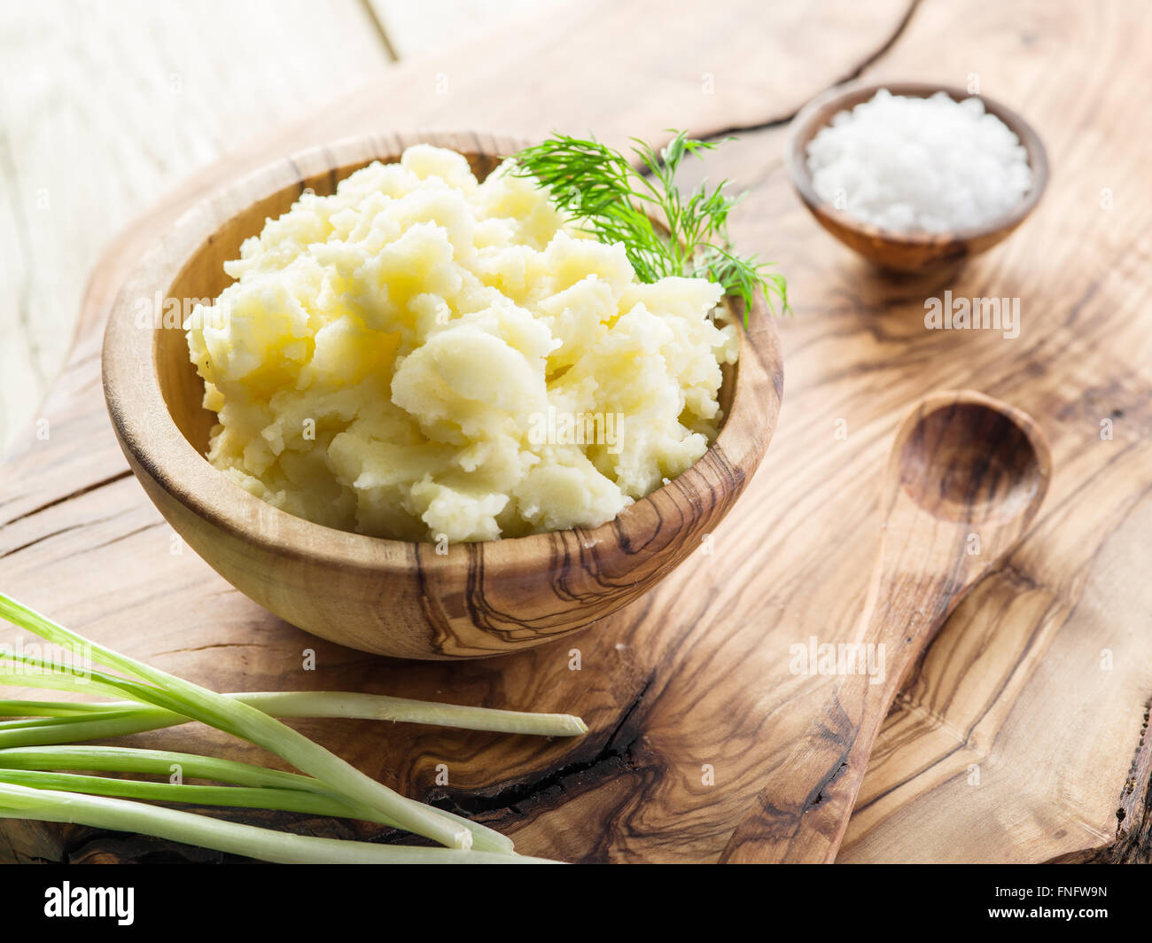 Mashed potatoes in the wooden bowl on the service tray. Stock Photo