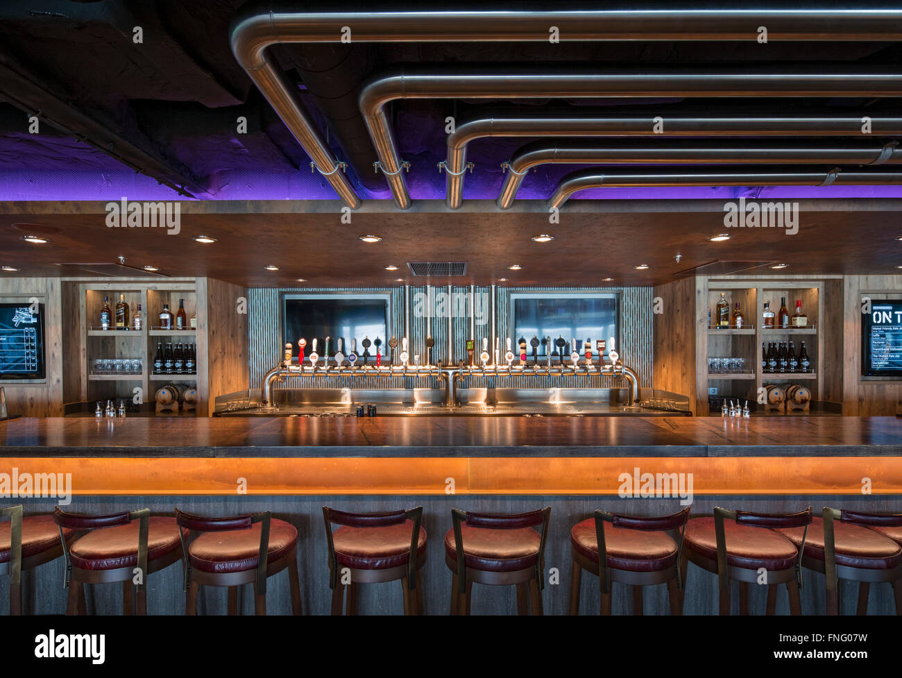 Bar in micro-brewery bar. Norwegian Cruise Ship – The Escape, Southampton, United Kingdom. Architect: SMC Design, 2015. Stock Photo