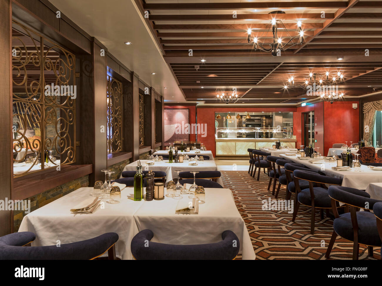 Italian restaurant. Norwegian Cruise Ship – The Escape, Southampton, United Kingdom. Architect: SMC Design, 2015. Stock Photo