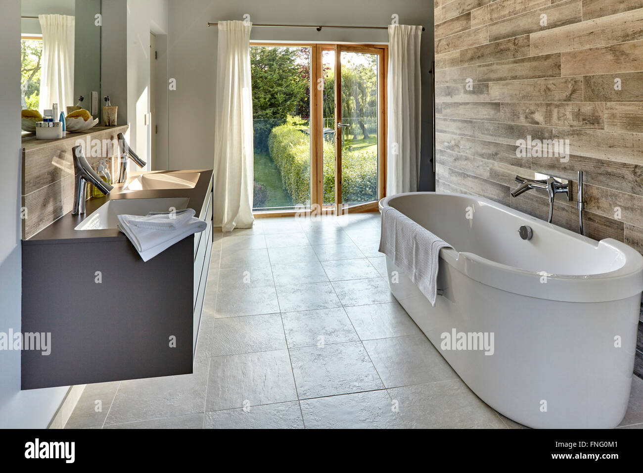 Master Bath Room With Double Full Height Glass Doors Opening