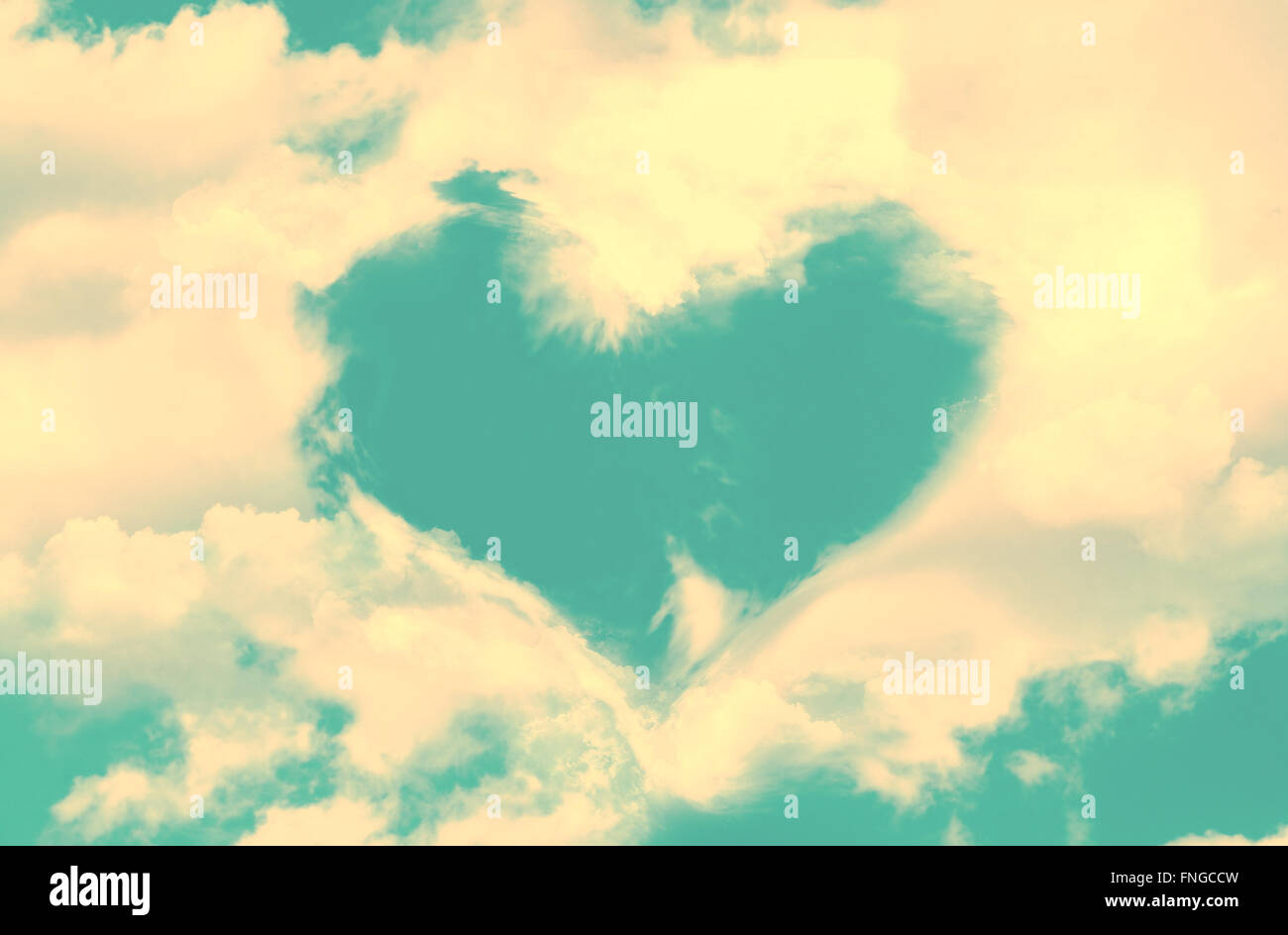 Clouds in the shape of a heart, blue sky, vintage process Stock Photo ...