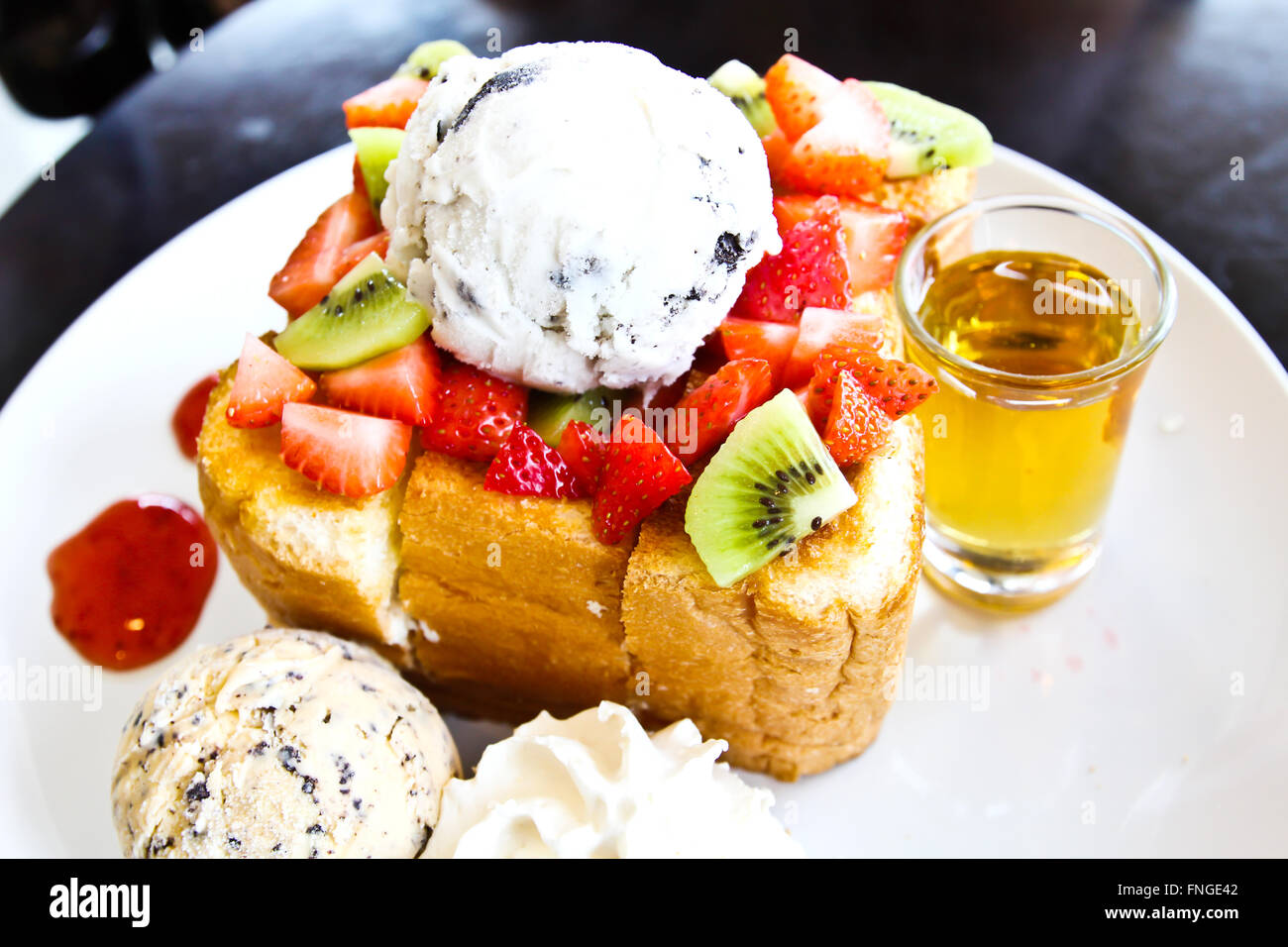 Honey toast with ice cream and fruit Stock Photo